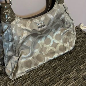 Gray and silver Coach hobo bag
